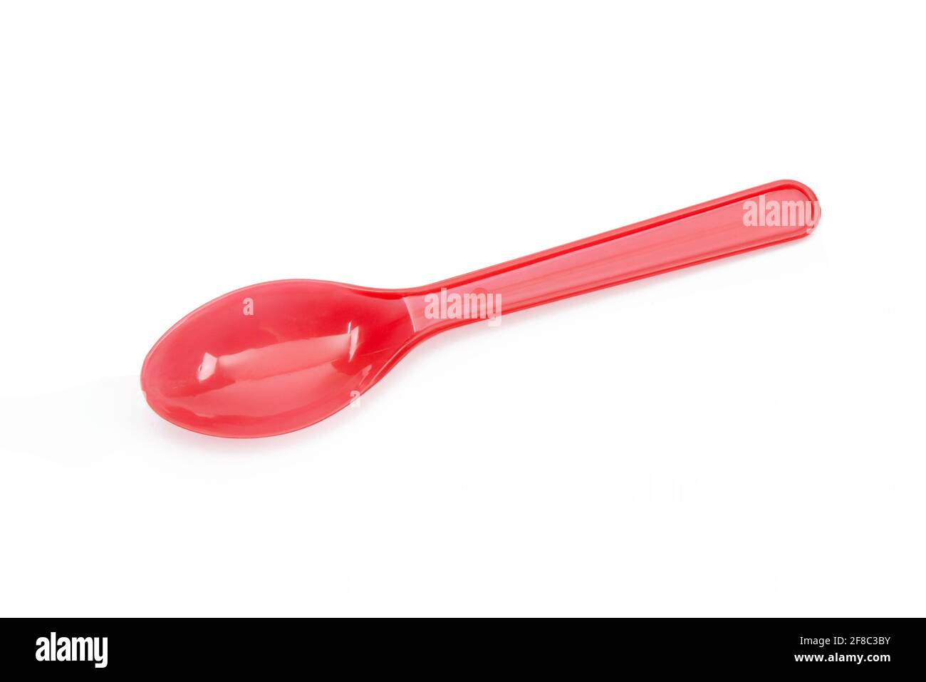 Red plastic spoon isolated on white background Stock Photo