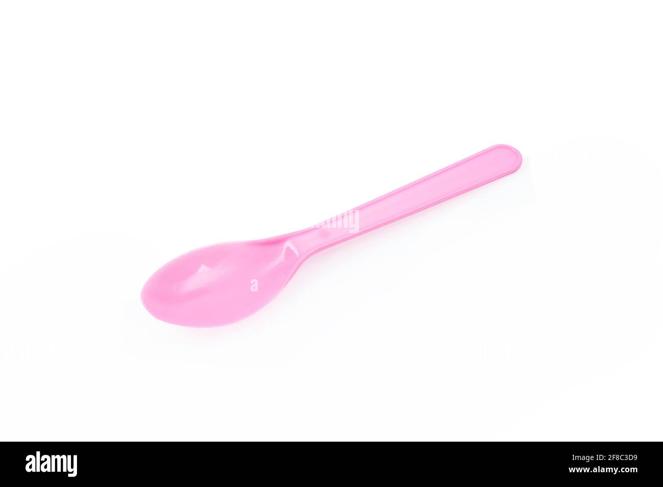 Pink plastic spoon isolated on white background Stock Photo