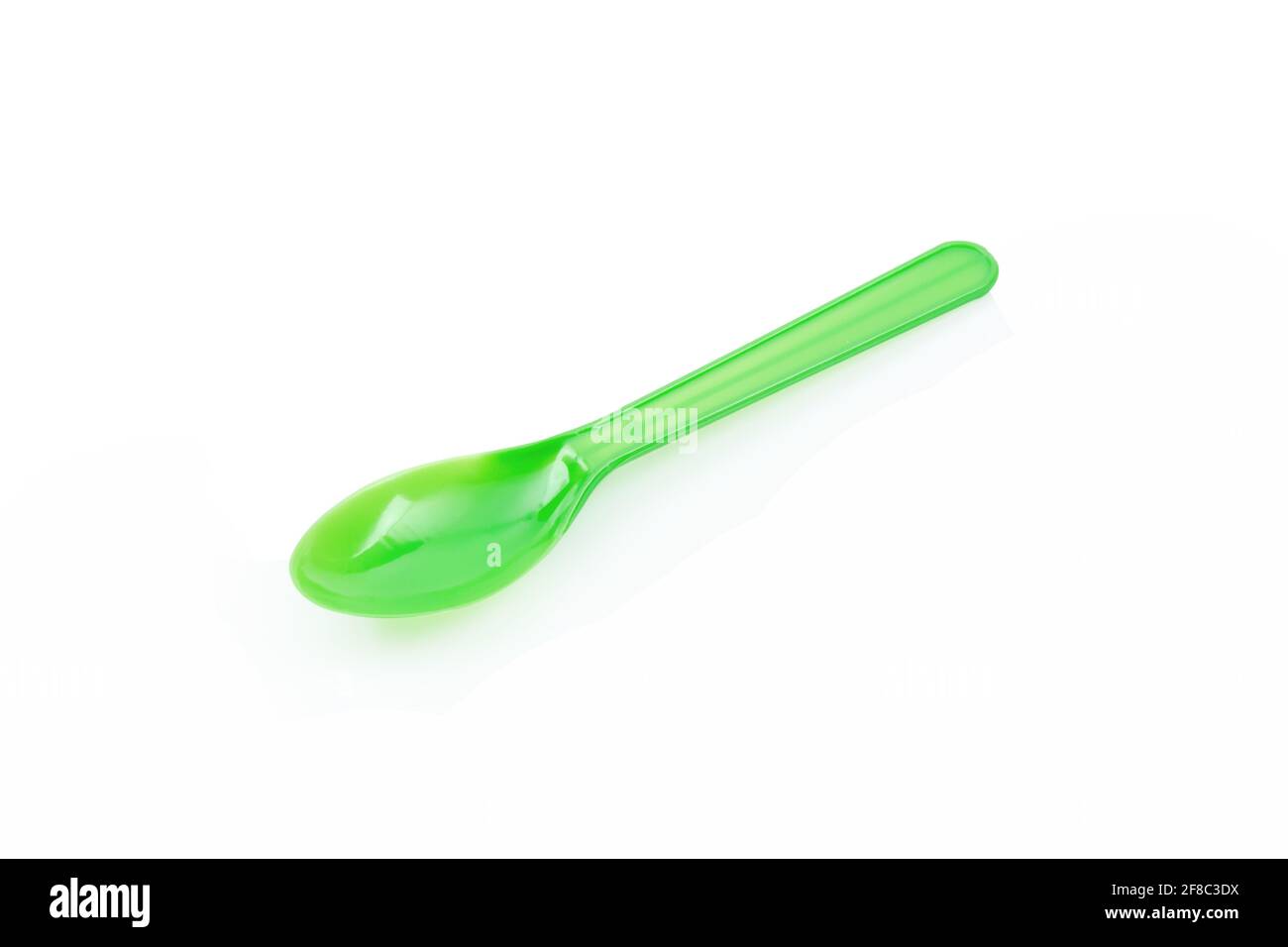 Green plastic spoon isolated on white background Stock Photo