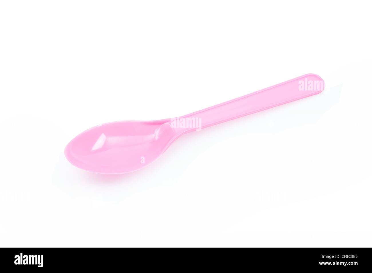 Pink plastic spoon isolated on white background Stock Photo - Alamy