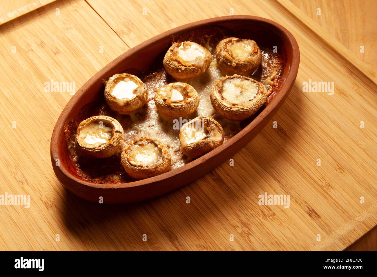 Baked white mushrooms in butter Stock Photo - Alamy