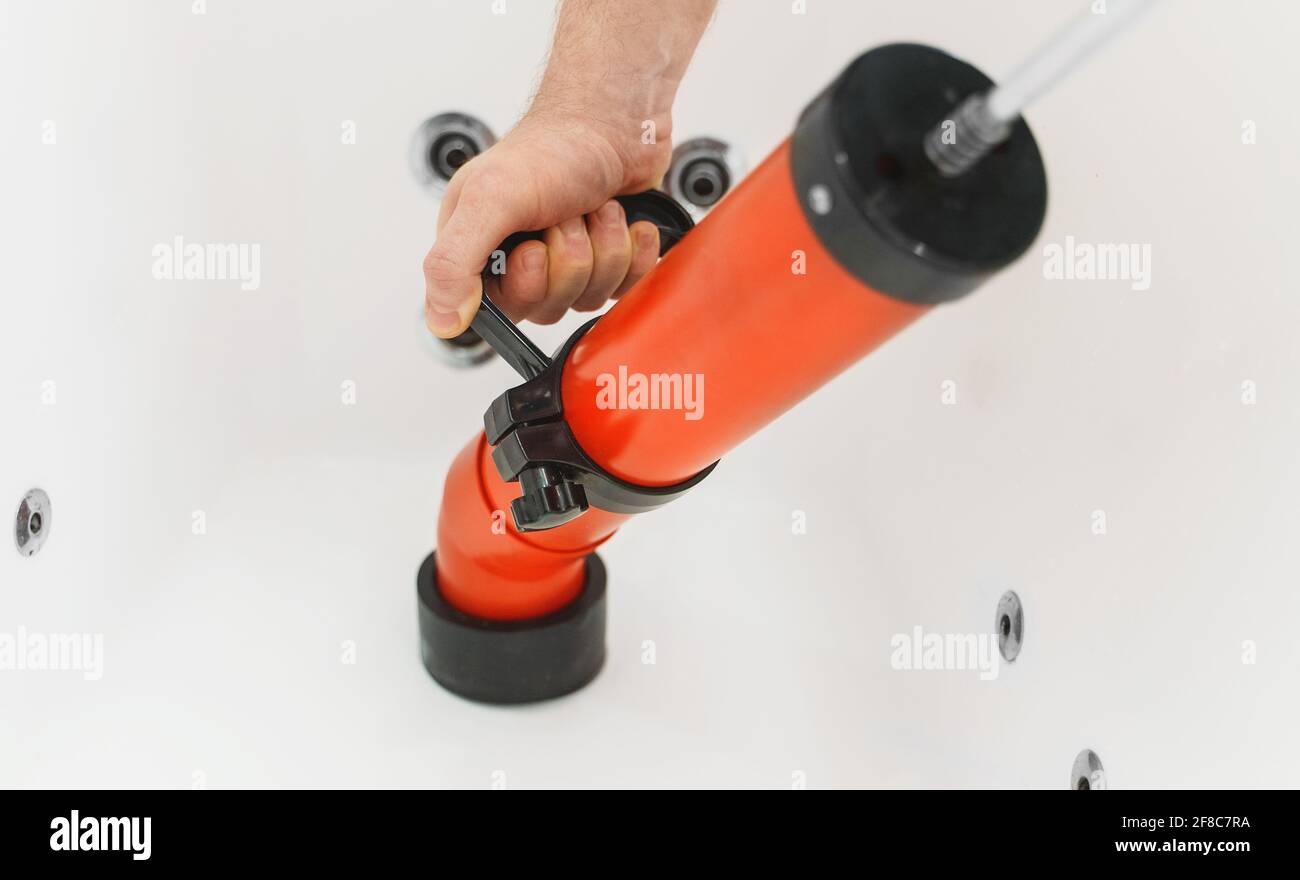 https://c8.alamy.com/comp/2F8C7RA/plumber-unclogging-bathtub-with-professional-force-pump-cleaner-2F8C7RA.jpg