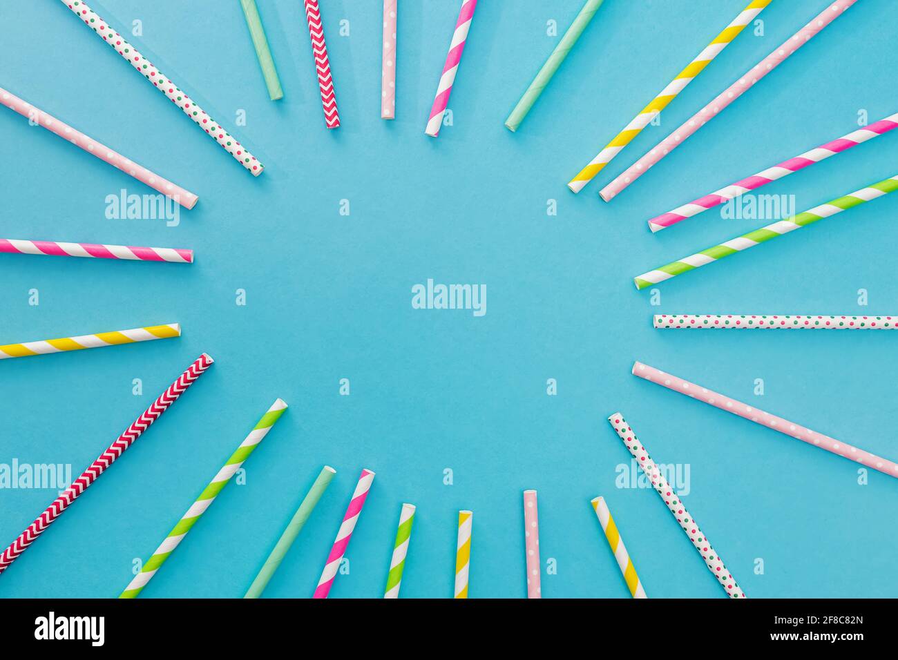 Multicolored party drinking straws arrenged into a circle Stock Photo