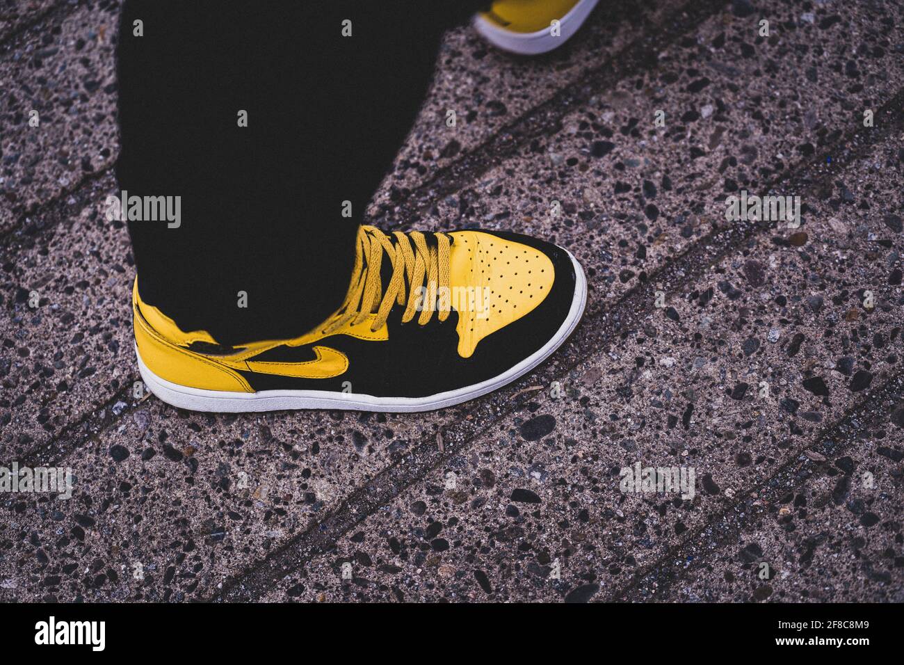 VANCOUVER, CANADA - Apr 12, 2021: Top down angled shot of nike air jordan  1s new love retro mid sole sneaker on the cement ground Stock Photo - Alamy
