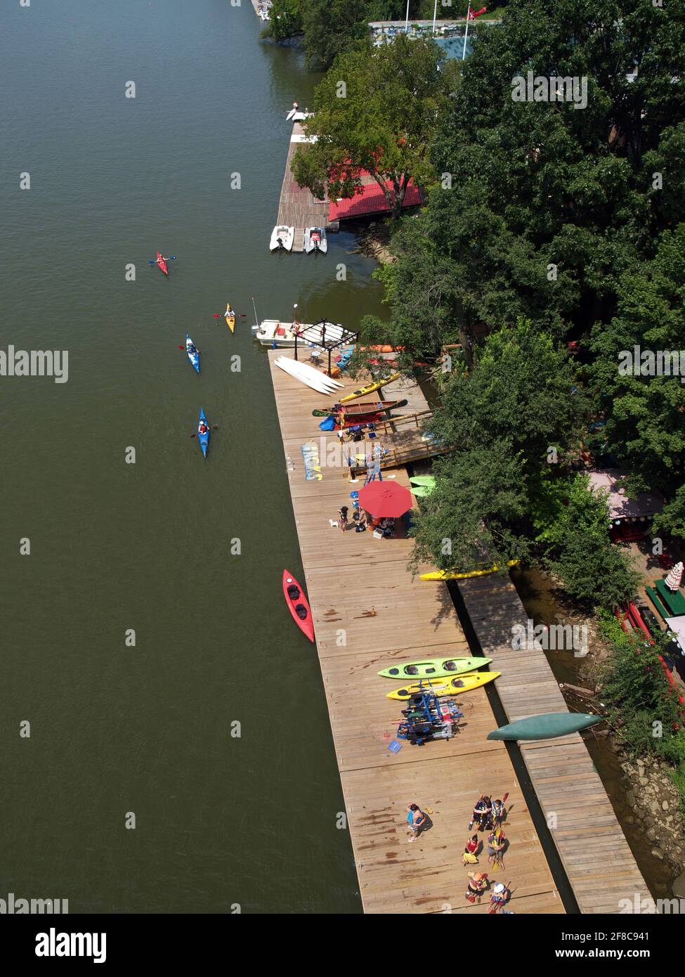The Georgetown waterfront near Key Bridge over the Potomac River in Washington D.C. sports recreational canoeing and kayaking in the summer. Stock Photo