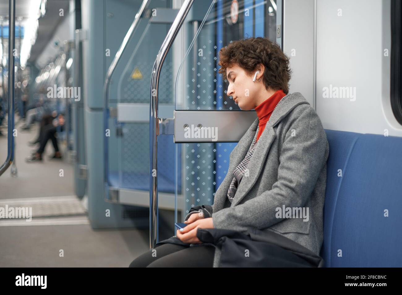 Asleep on subway hi-res stock photography and images - Alamy
