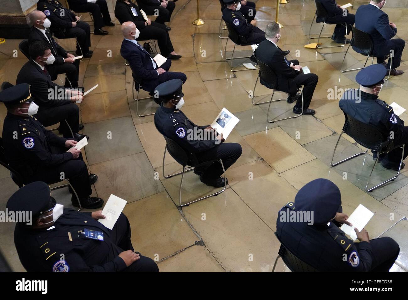 Washington, United States. 13th Apr, 2021. Police officers wait for the start of a ceremony honoring fallen U.S. Capitol Police officer William "Billy" Evans at the Capitol in Washington DC, on Tuesday, April 13, 2021. Pool photo by Amr Alfiky/UPI Credit: UPI/Alamy Live News Stock Photo