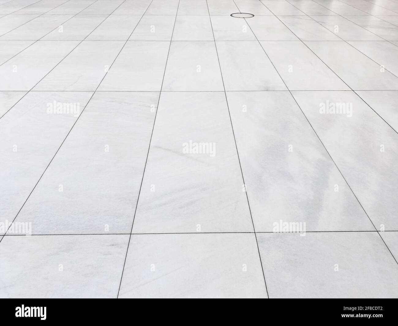 Looking down on a marble tiled floor Stock Photo