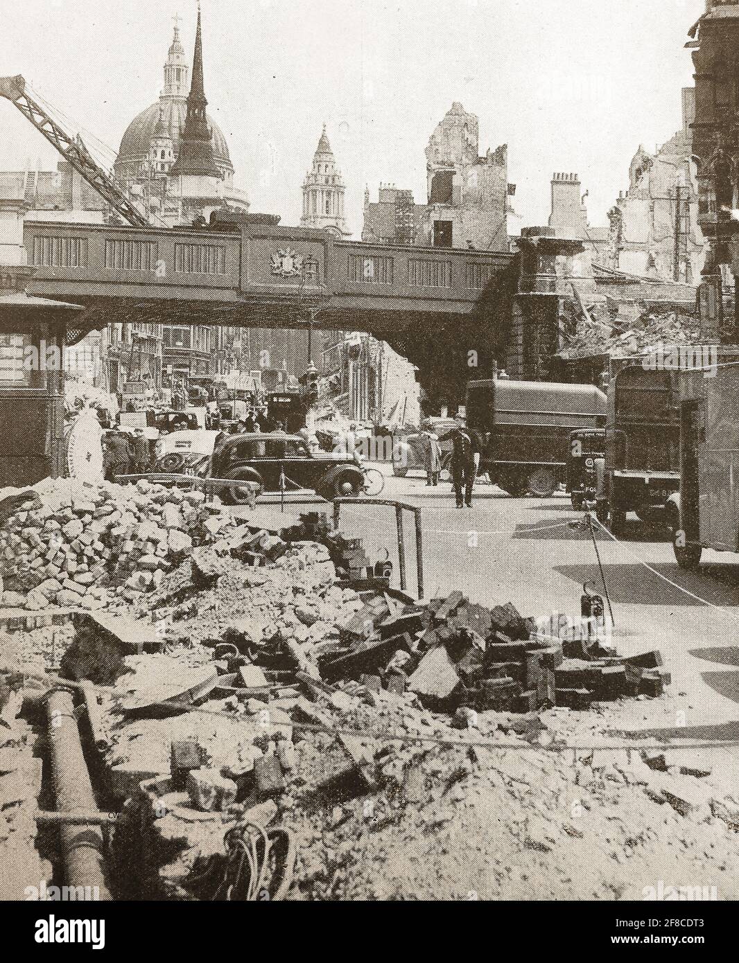 1940 The blitz - Newspaper image -Looking up Ludgate Hill, London towards St Paul's Cathedral the morning after an an air raid by German bombers. Stock Photo