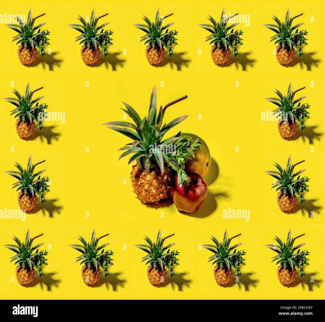 Many pineapples on a solid yellow background pattern Stock Photo