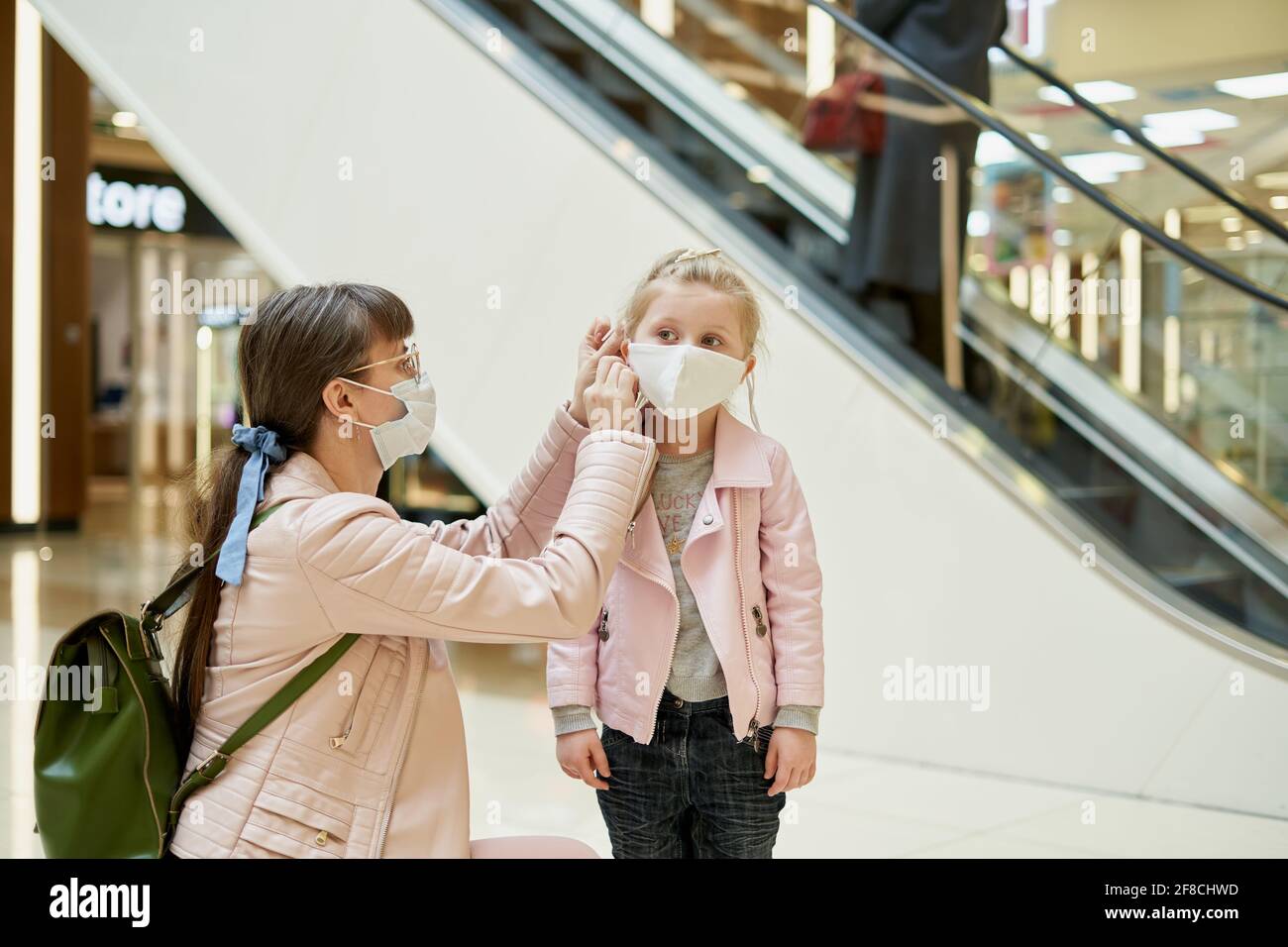 Girl puts mask hi-res stock photography and images - Alamy