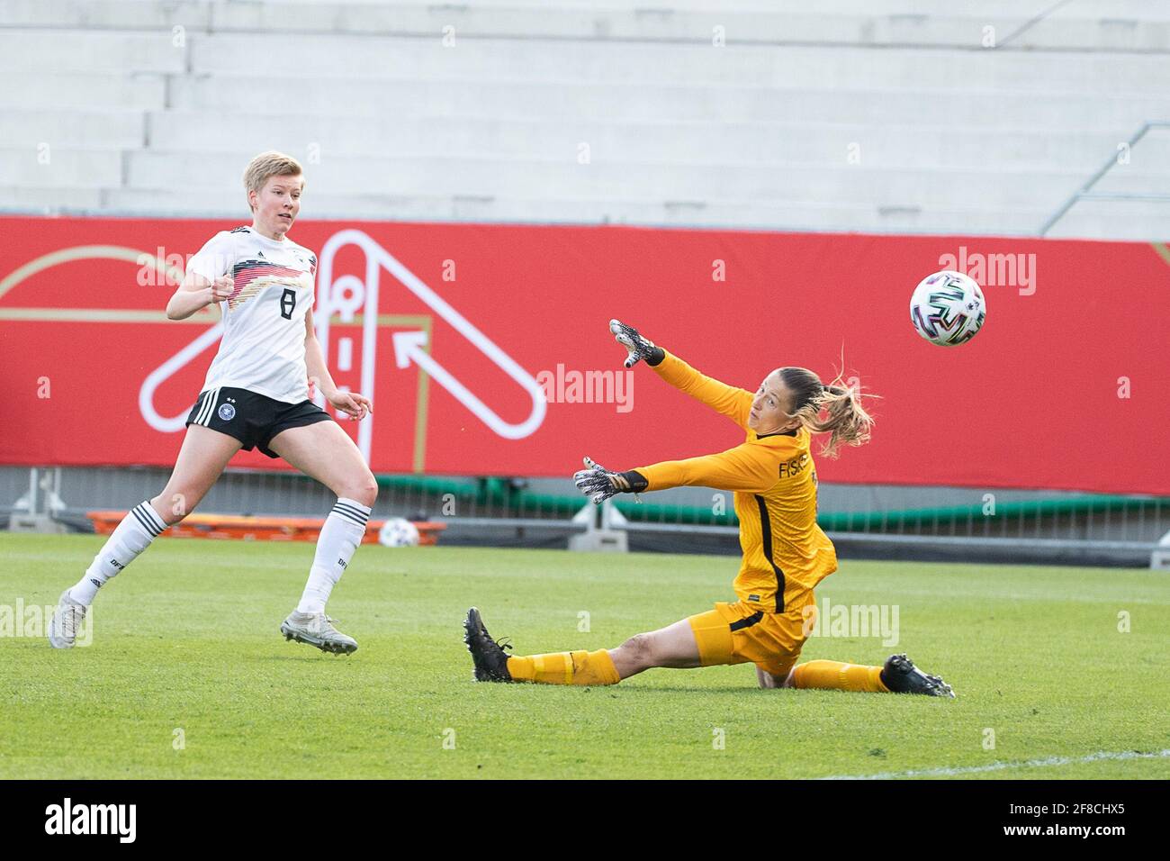 13 April 2021, Hessen, Wiesbaden: Football, Women: Internationals, Germany - Norway. Germany's Paulina Krumbiegel (l) scores the goal for 3:1 against Norway's goalkeeper Cecilie Fiskerstrand. Photo: Sebastian Gollnow/dpa Stock Photo