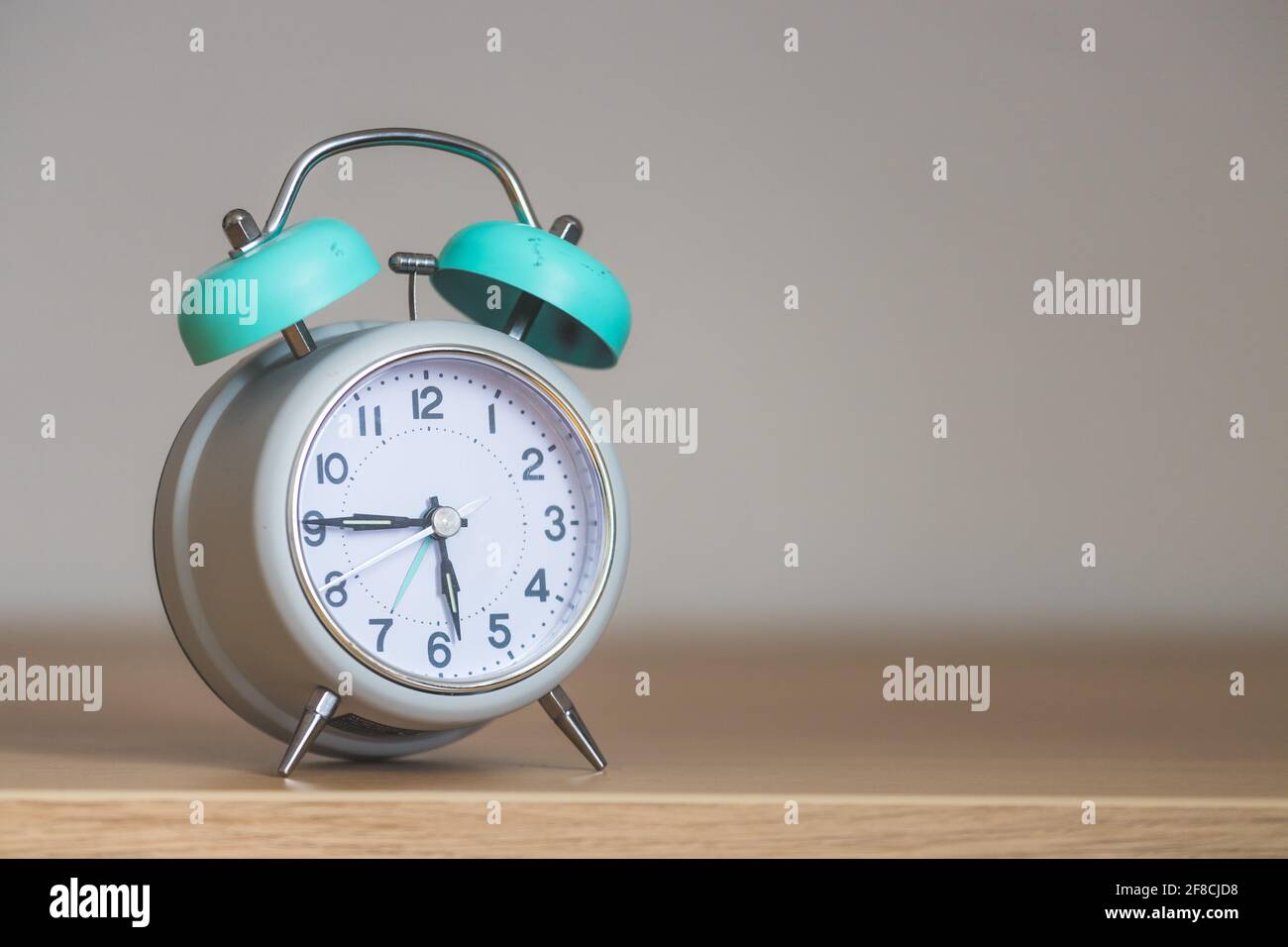 Retro styled white alarm clock, isolated and copy space, Stock Photo