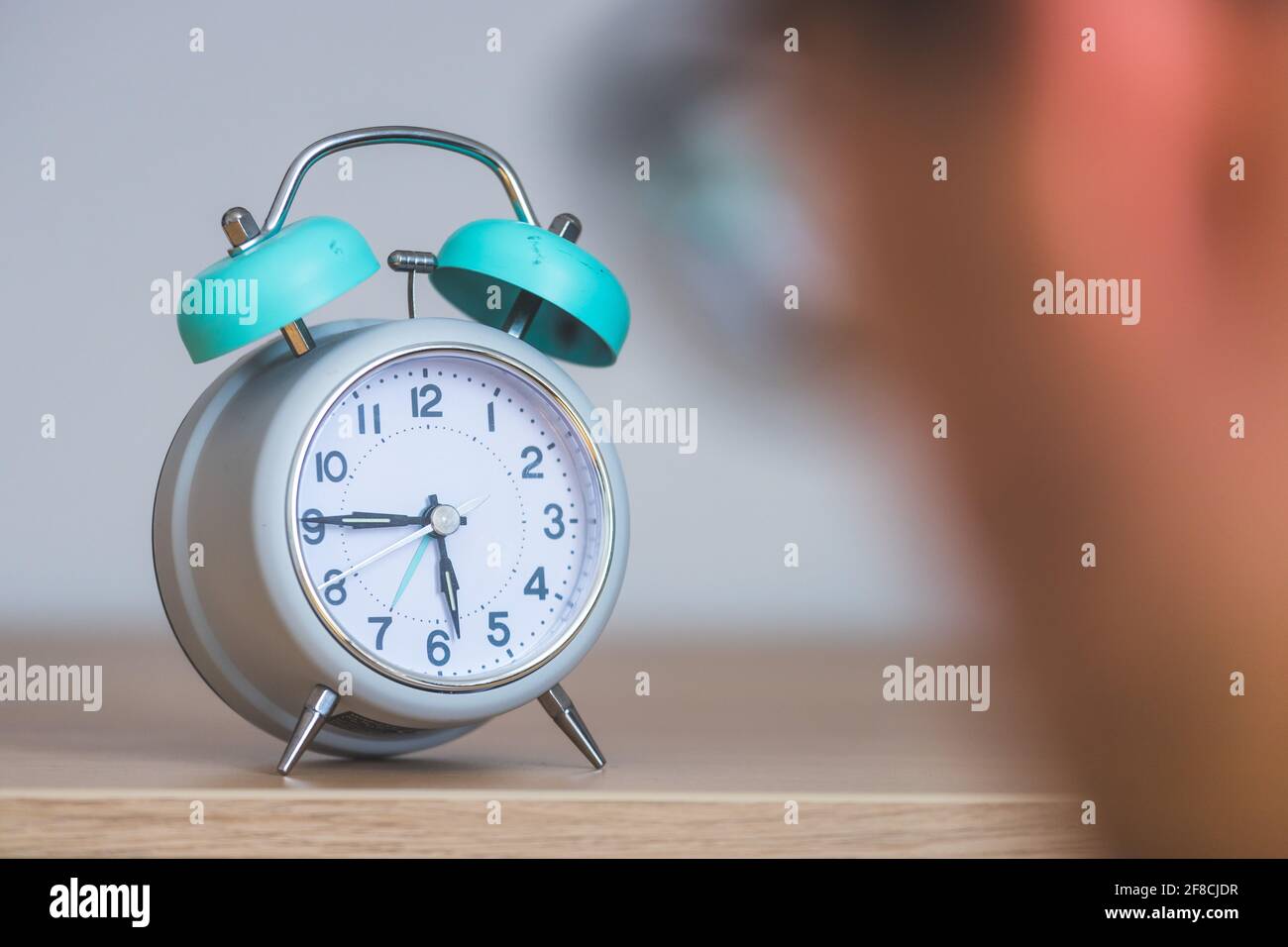 Retro styled white alarm clock Stock Photo