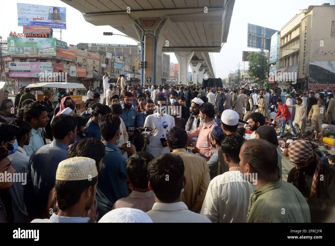 Leaders and activists of Tehreek-e-Labbaik (TLP) block road as they are holding protest demonstration against arrested of Saad Hussain Rizvi, Chief of Tehreek-e-Labbaik Pakistan (TLP) son of late cleric Khadim Hussain Rizvi, at Murree road in Rawalpindi on Tuesday, April 13, 2021. Stock Photo
