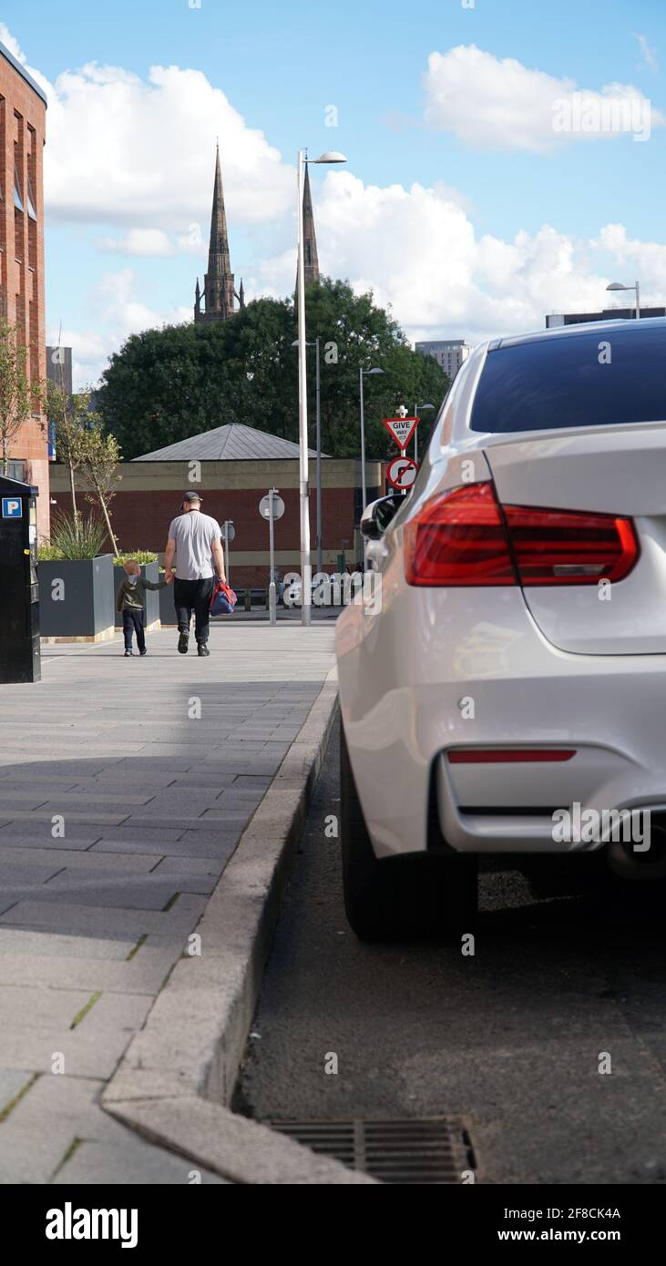BMW and Coventry Cathedral Spires Stock Photo Alamy