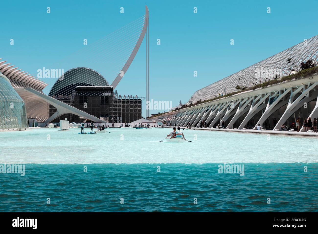 People enjoying the boats on the artificial lake in front of the Palau de les Arts in the City of Arts and Sciences, Valencia, Spain. Stock Photo