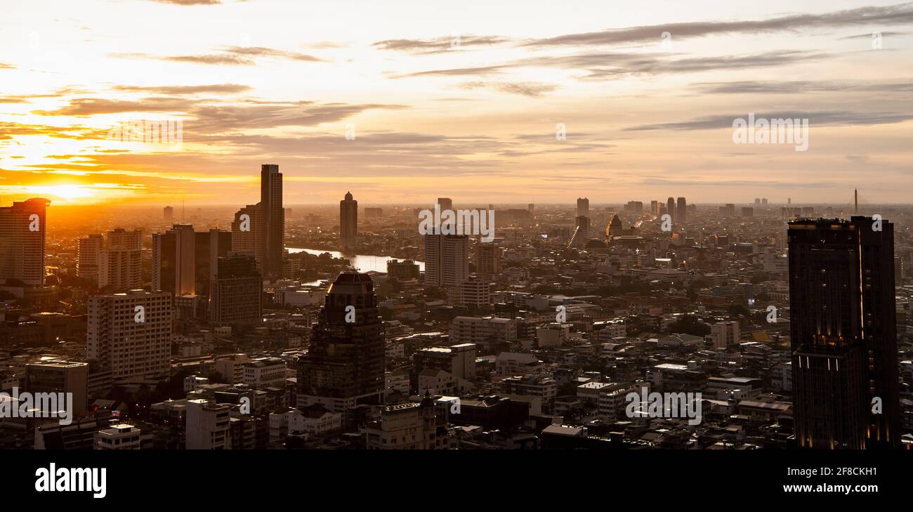 the Bangkok skyline at sunset seen from Sathorn district Stock Photo