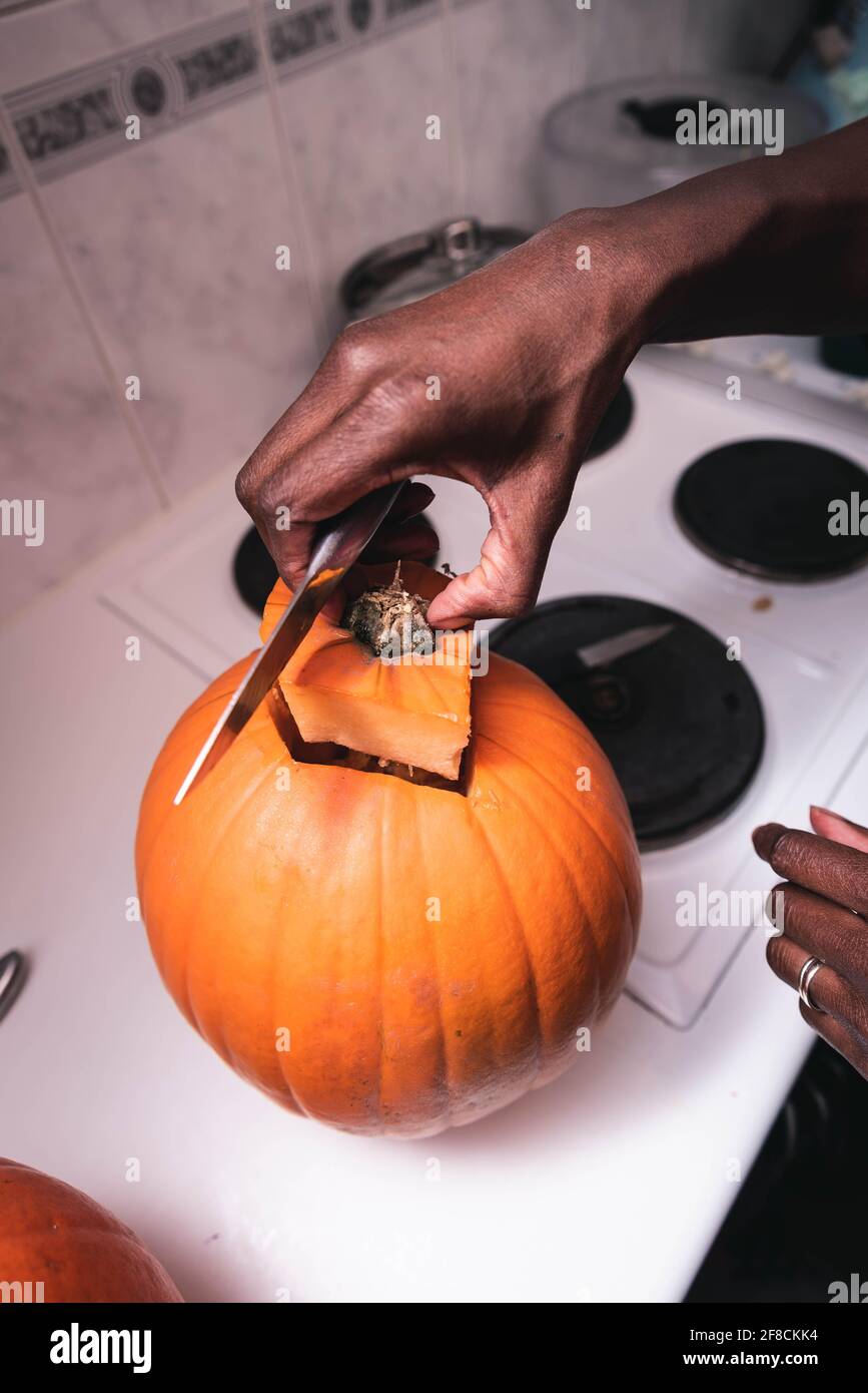 Pumpkins carved by black woman for halloween. Stock Photo