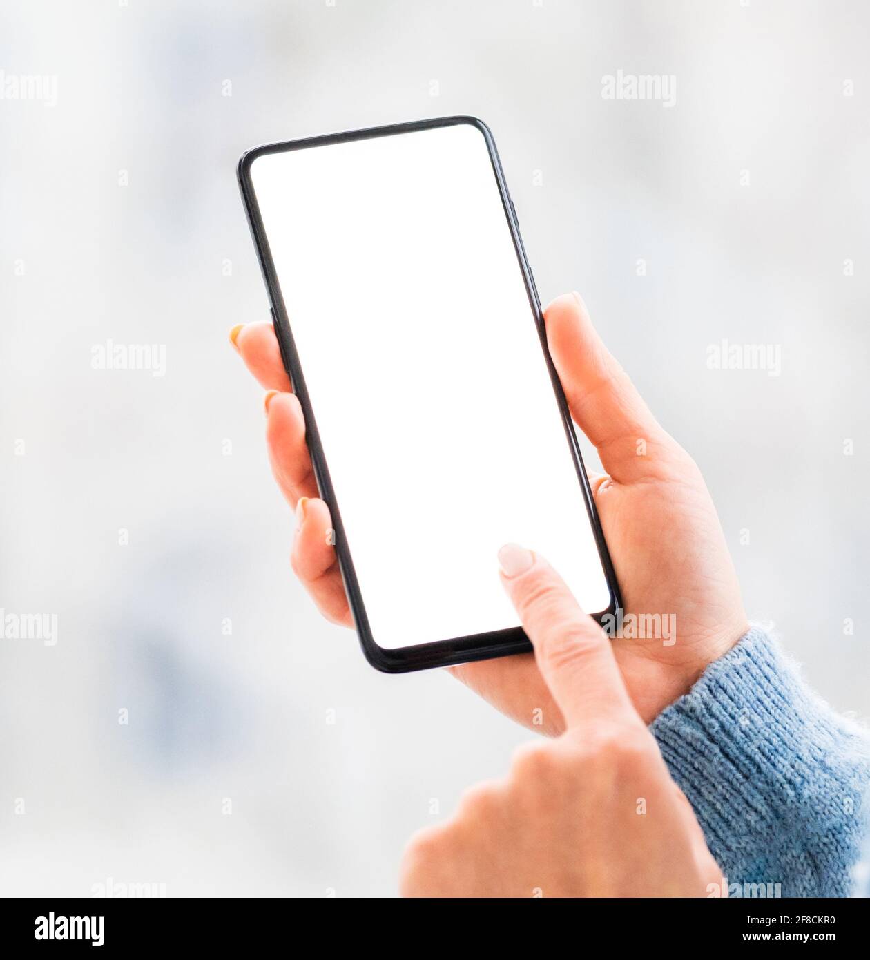 Hands working on mobile phone close up Stock Photo