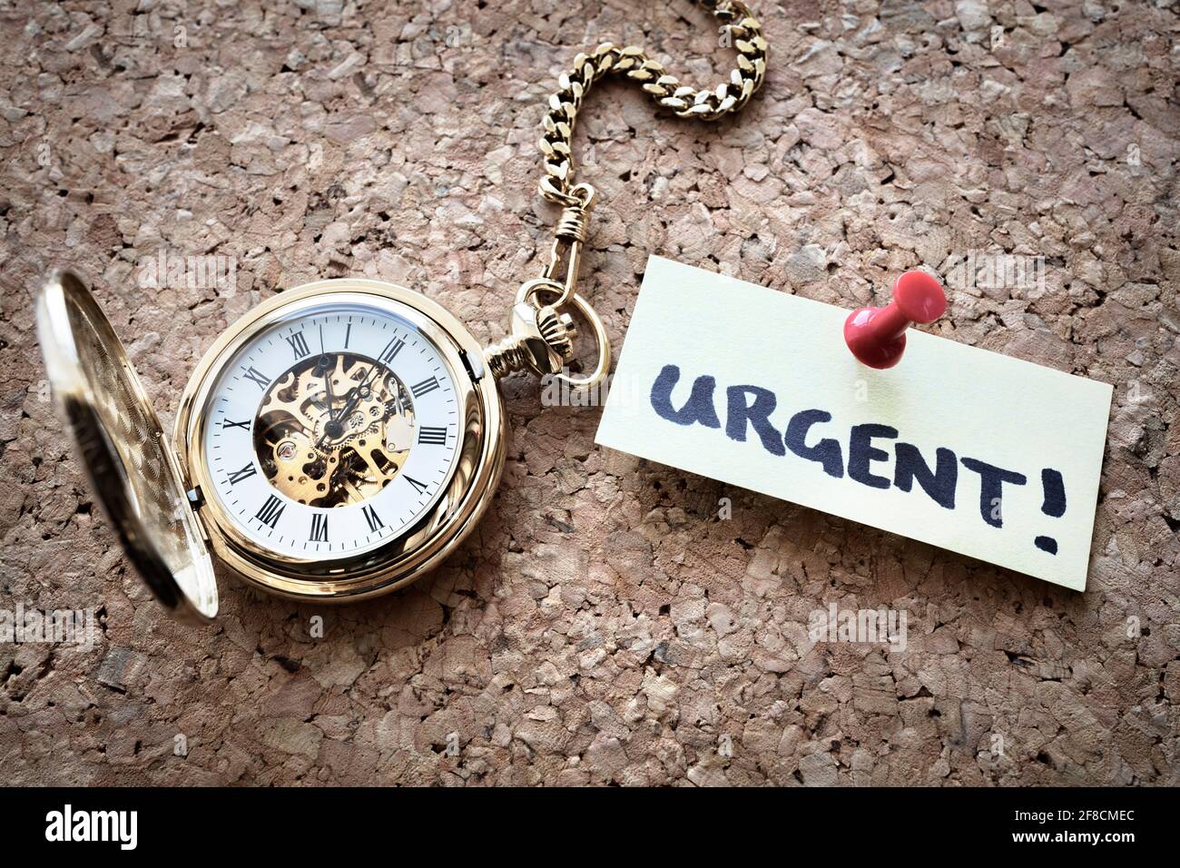 Urgent deadline note and time on pocket watch Stock Photo