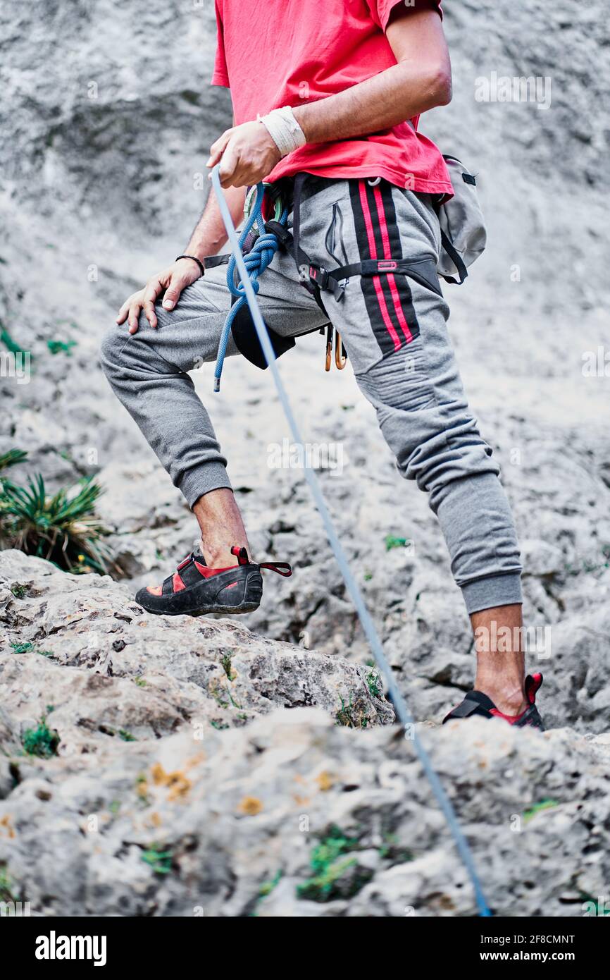 Closeup of a man with the climbing and mountaineering harness
