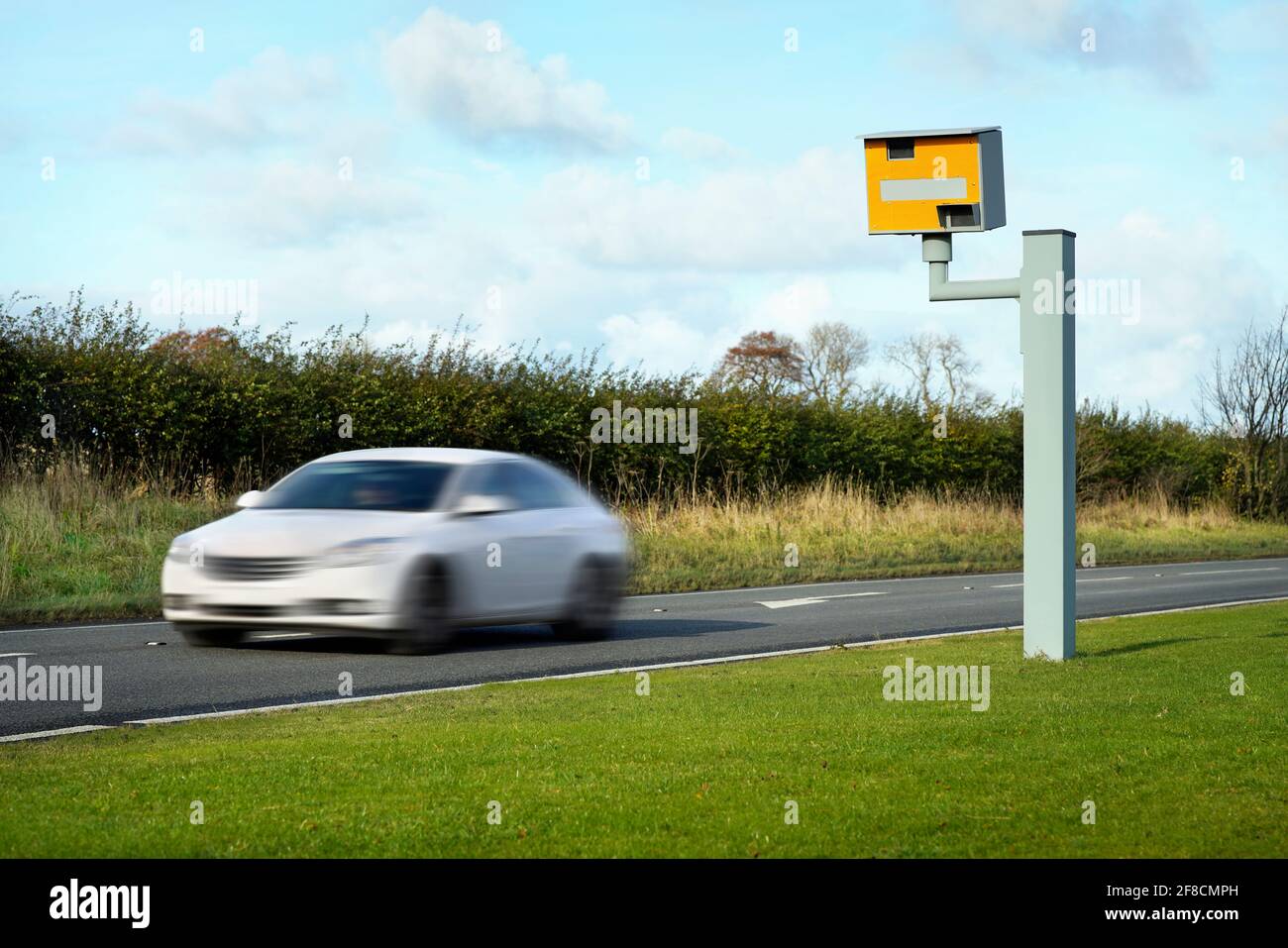 Radar speed camera and fast car on the road Stock Photo