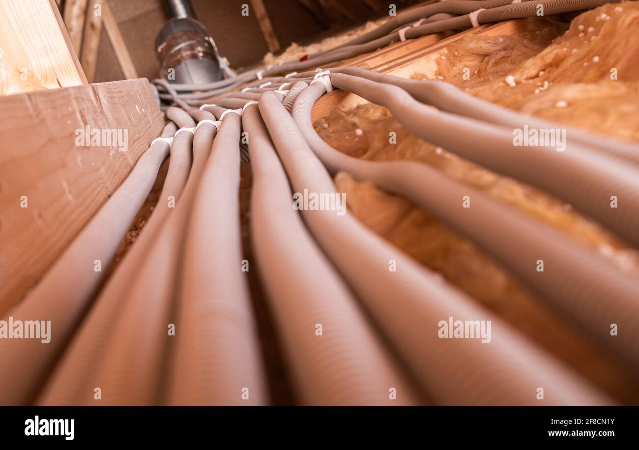 Electric Cables in Enclosed Plastic Pipelines in the House Attic. Residential Electric System