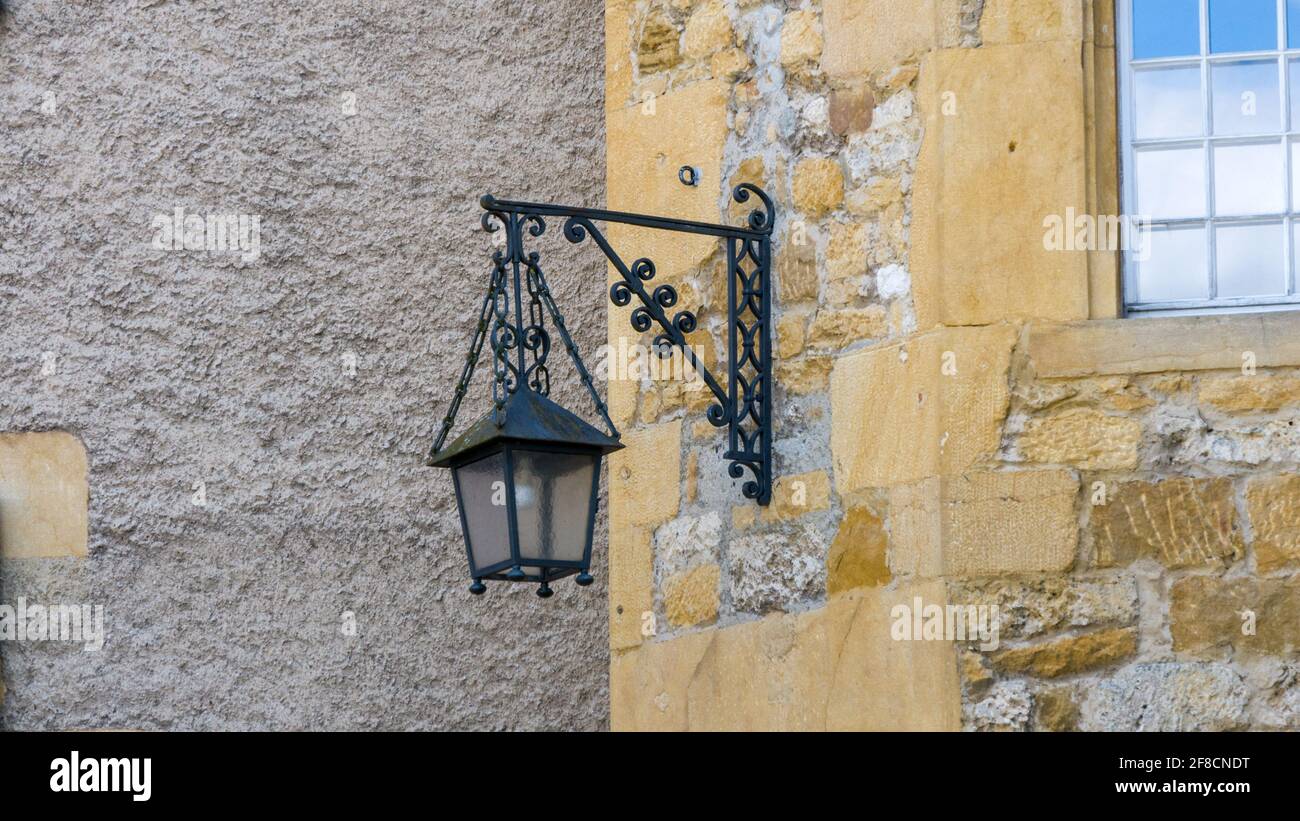 Old lantern on the castle wall Stock Photo