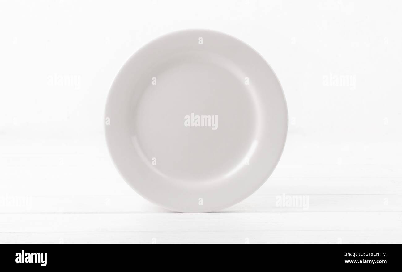 Blank white ceramic dinner dish Stock Photo