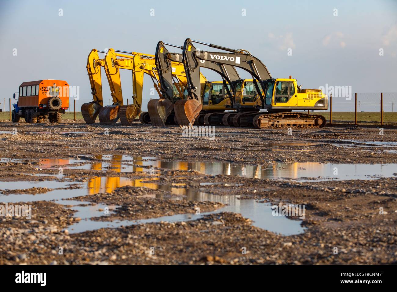 Yellow construction excavators machines on parking. Turkestan, Kazakhstan. Stock Photo