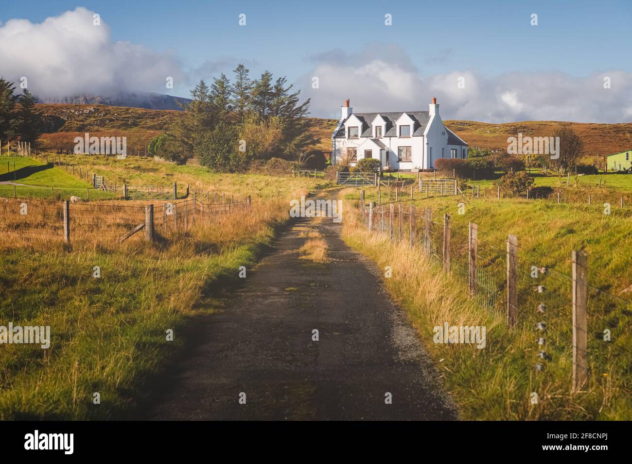 Traditional, rural country croft house in idyllic countryside scenery at Staffin on the Isle of Skye, Scottish Highlands, Scotland. Stock Photo