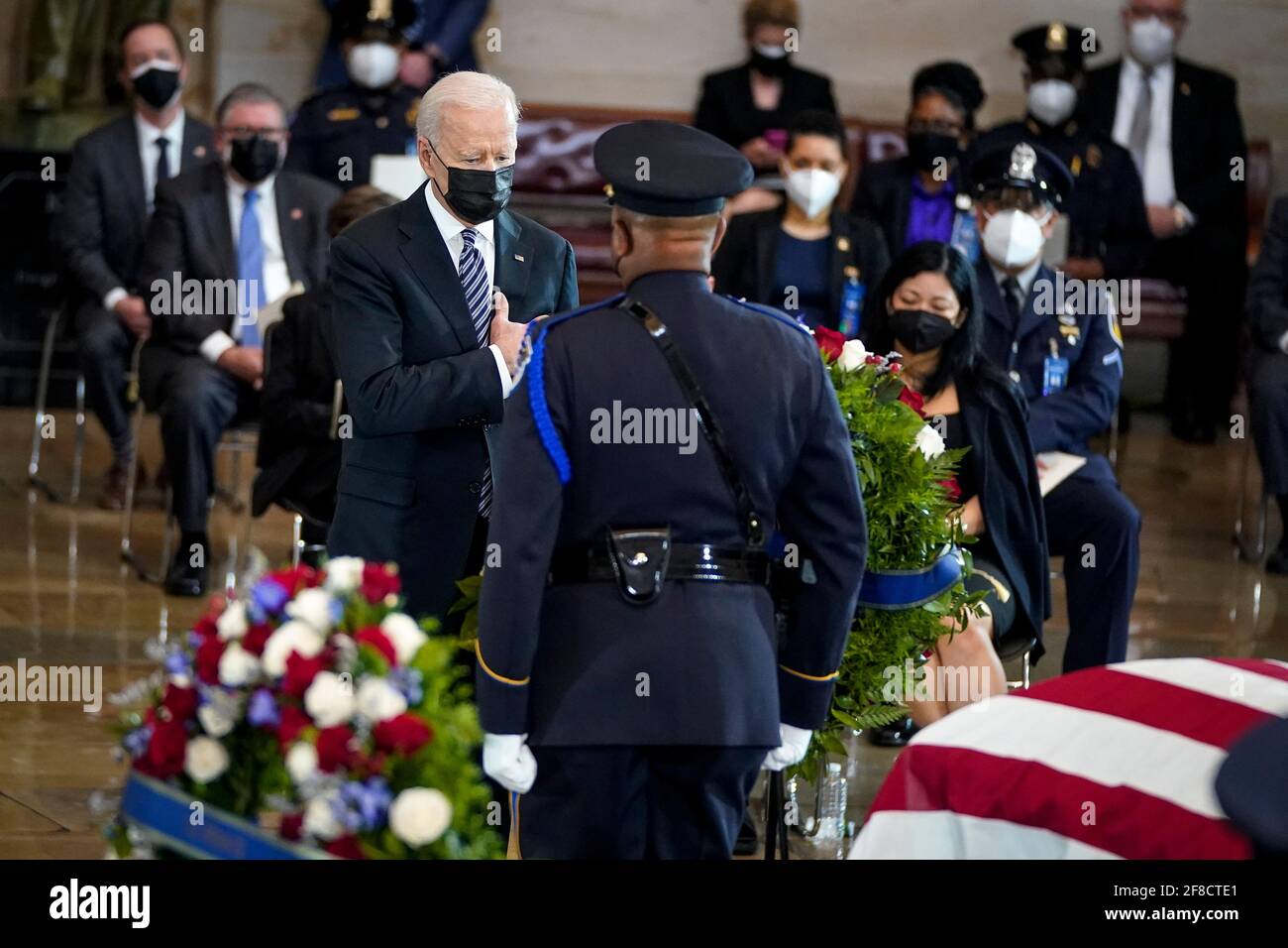 WASHINGTON, DC - APRIL 13: President Joe Biden pays his respects at the casket of the late U.S. Capitol Police officer William 'Billy' Evans during a memorial service as Evans lies in honor in the Rotunda at the U.S. Capitol on April 13, 2021 in Washington, DC. Officer Evans was killed in the line of duty during the attack outside the U.S. Capitol on April 2. He is the sixth Capitol Police officer to die in the line of duty in the nearly 200 years since the force was created. (Photo by Drew Angerer/Pool/Sipa USA) Stock Photo