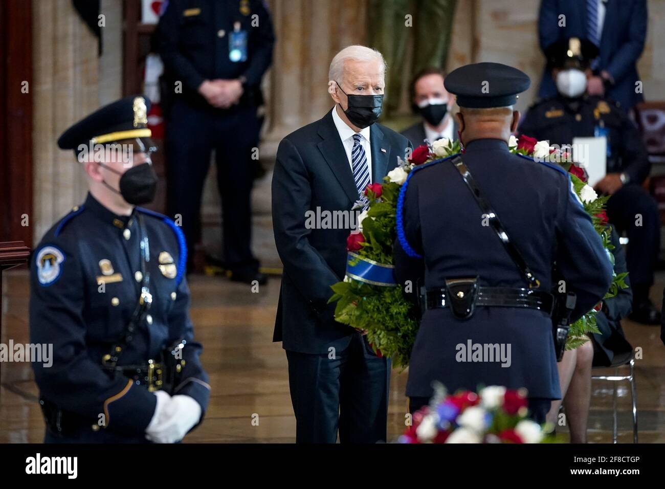 WASHINGTON, DC - APRIL 13: President Joe Biden pays his respects at the casket of the late U.S. Capitol Police officer William 'Billy' Evans during a memorial service as Evans lies in honor in the Rotunda at the U.S. Capitol on April 13, 2021 in Washington, DC. Officer Evans was killed in the line of duty during the attack outside the U.S. Capitol on April 2. He is the sixth Capitol Police officer to die in the line of duty in the nearly 200 years since the force was created. (Photo by Drew Angerer/Pool/Sipa USA) Stock Photo
