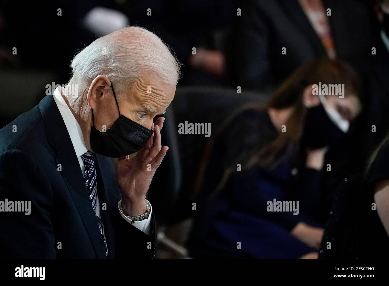 WASHINGTON, DC - APRIL 13: President Joe Biden rubs his eye during a memorial for the late U.S. Capitol Police officer William 'Billy' Evans as he lies in honor in the Rotunda at the U.S. Capitol on April 13, 2021 in Washington, DC. Officer Evans was killed in the line of duty during the attack outside the U.S. Capitol on April 2. He is the sixth Capitol Police officer to die in the line of duty in the nearly 200 years since the force was created. (Photo by Drew Angerer/Pool/Sipa USA) Stock Photo