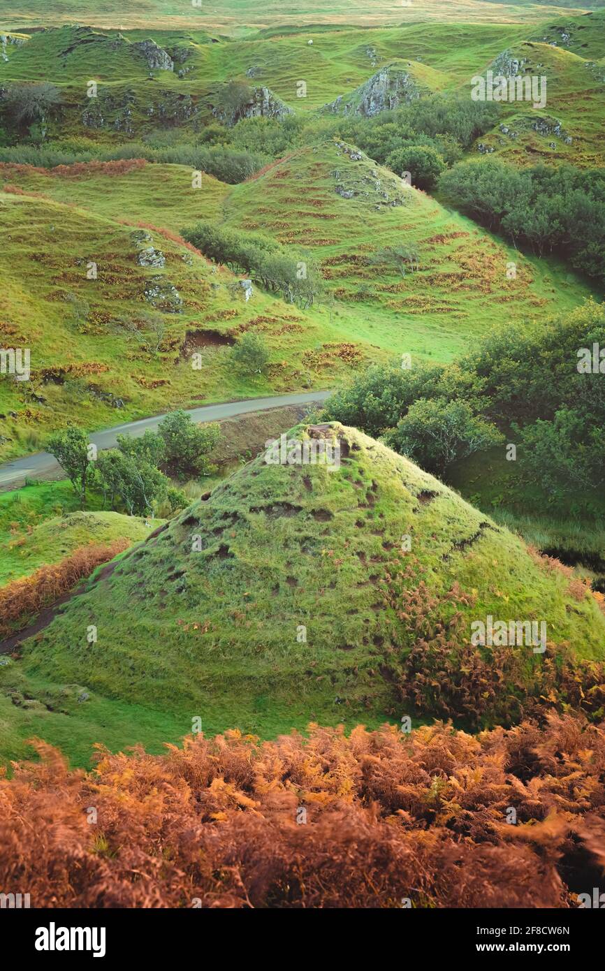 Ancient green conical mounds at the tourist attraction the Fairy Glen on the Isle of Skye