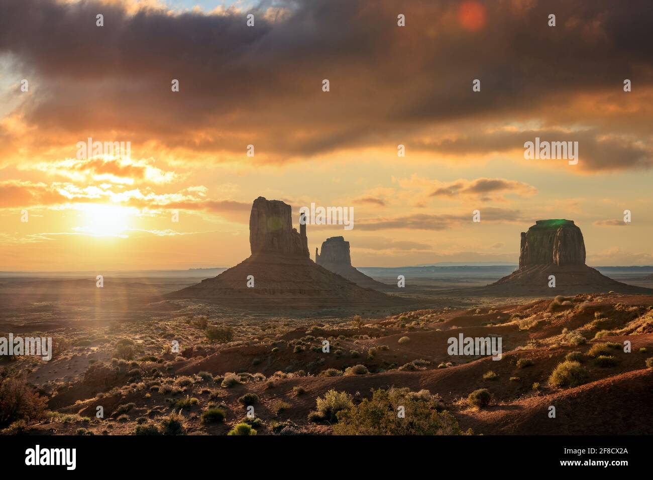 Monument valley landscape, cloudy sky at sunset sunrise. Navajo tribal park, United states of America, Utah, Arizona desert. Stock Photo