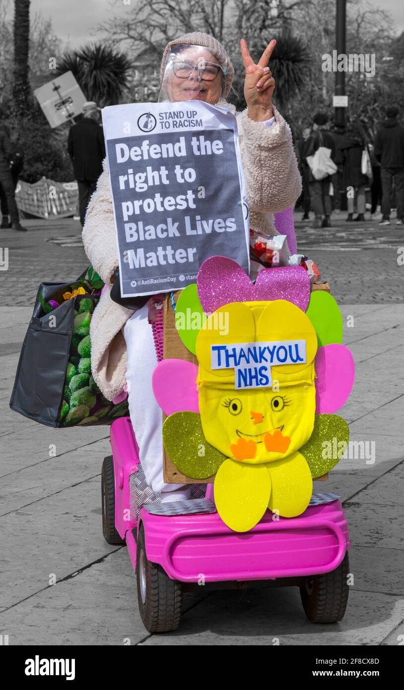 Woman riding pink mobility scooter at Kill the Bill protest at Bournemouth, Dorset UK in April - defend the rights to protest black lives matter Stock Photo