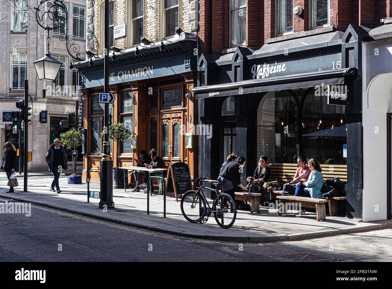 People enjoying easing up of COVID-19 restrictions at a coffee shop terrace, London, England, UK. Stock Photo