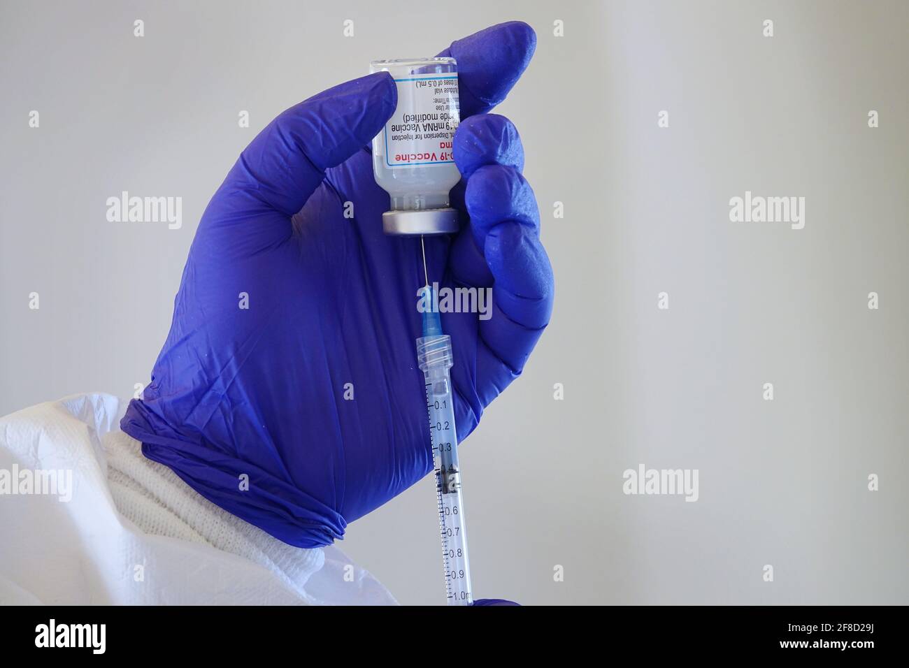 Close up of a vial of Moderna Covid-19 vaccine used in an Italian vaccination centre. Turin, Italy - April 2021 Stock Photo