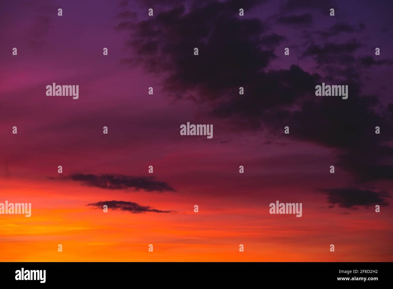 Bright colorful sunset sky with few clouds Stock Photo