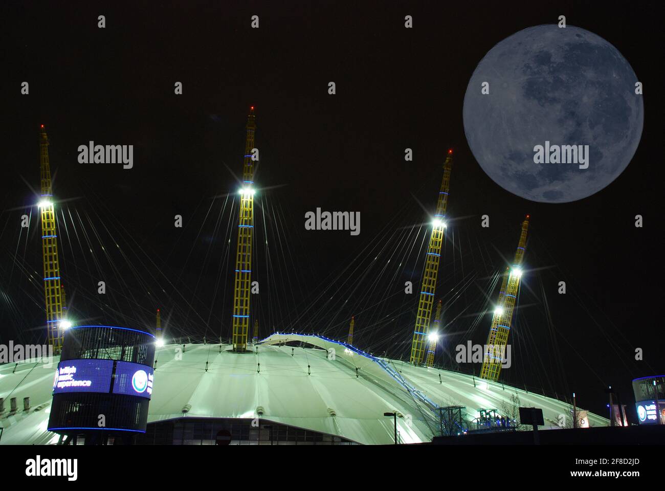 A full moon over the O2 Arena entertainment complex in Greenwich, London, UK Stock Photo