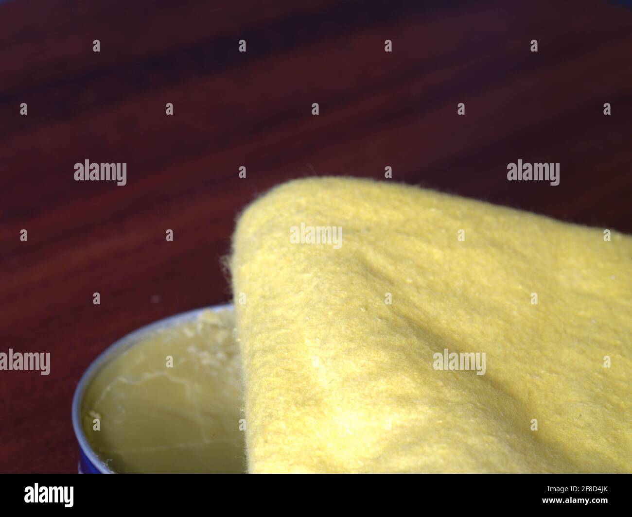 yellow duster and furniture polish wax tin Stock Photo Alamy