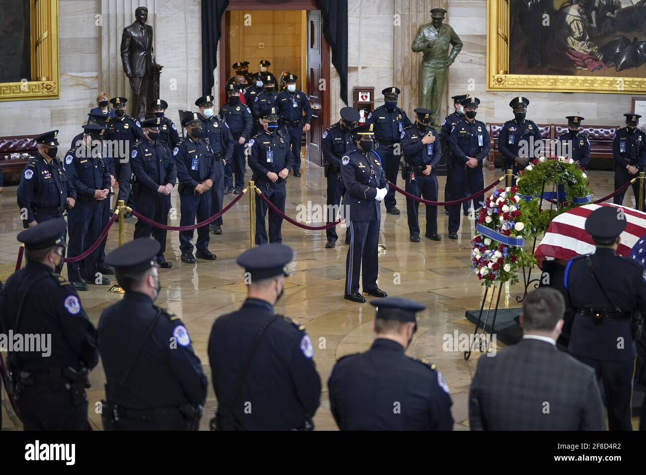 Capitol Police officers pay their respects at the casket of the late U.S. Capitol Police officer William 'Billy' Evans during a memorial service as Evans lies in honor in the Rotunda at the U.S. Capitol in Washington DC, on Tuesday April 13, 2021. Evans was killed in the line of duty during the attack outside the U.S. Capitol on April 2. Pool photo by Drew Angerer/UPI Credit: UPI/Alamy Live News Stock Photo
