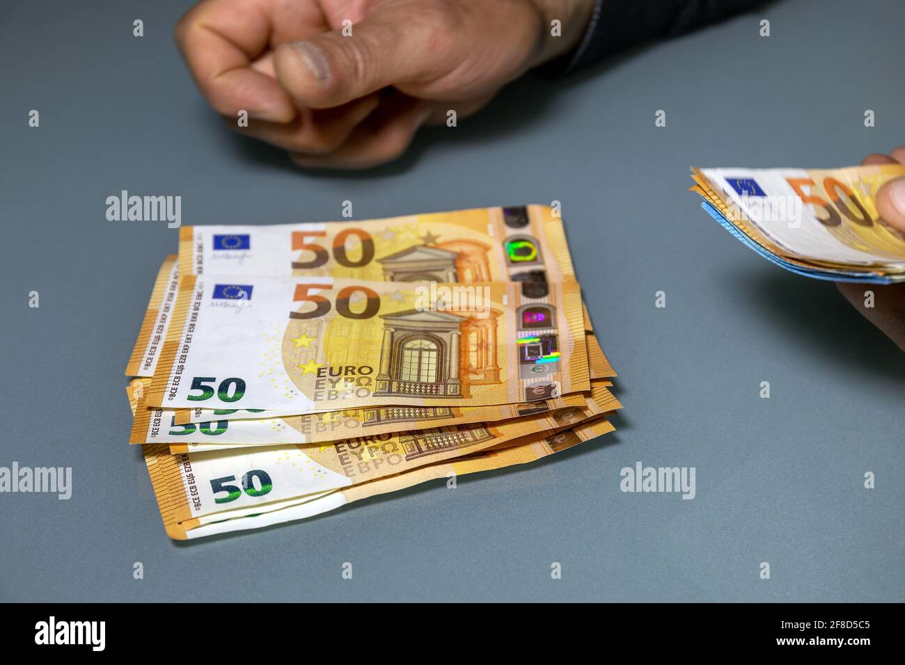 Manual counting of euro banknotes. Cash, 50 euro bills and 20 euro bills  Stock Photo - Alamy