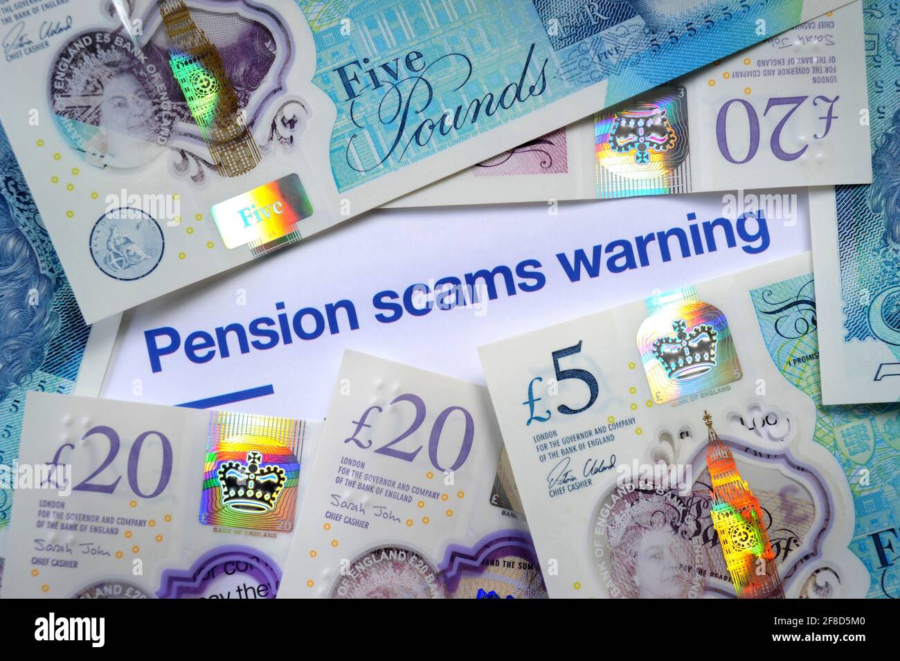 PENSION SCAMS WARNING LETTER WITH BRITISH CURRENCY NOTES RE SCAMS PENSIONS INVESTMENTS FRAUD ETC UK Stock Photo