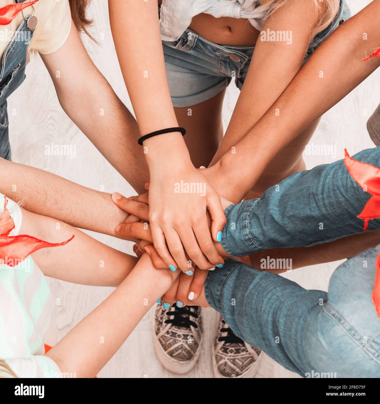 children keeping hands together as a team with friendship Stock Photo