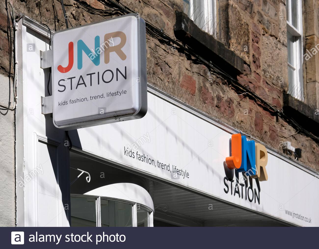 JNR Station shop sign, retailer of clothing for children, Rose Street