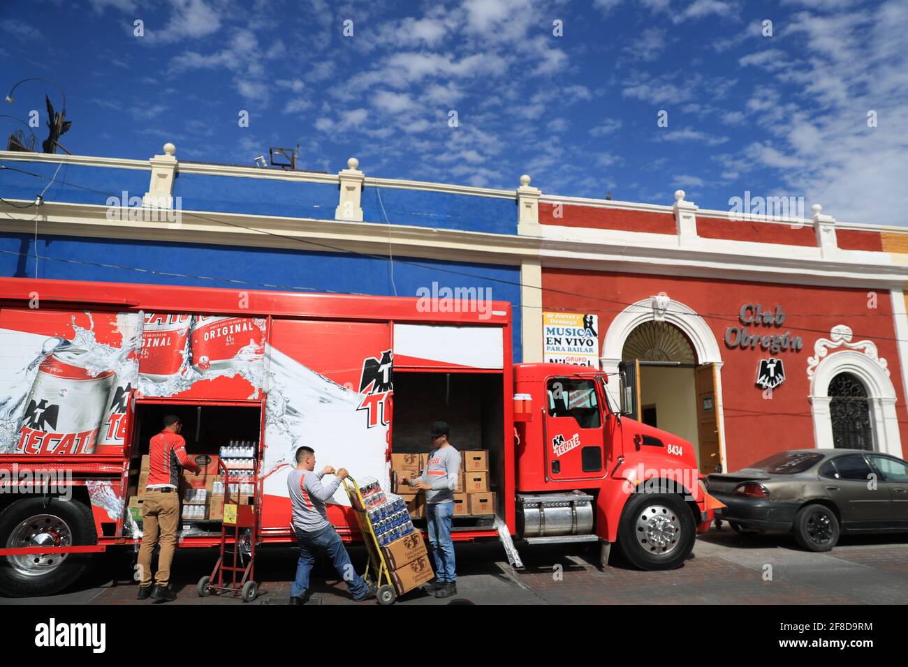 A delivery truck from the Cuatemoc Moctezuma or Tecate brewery sells