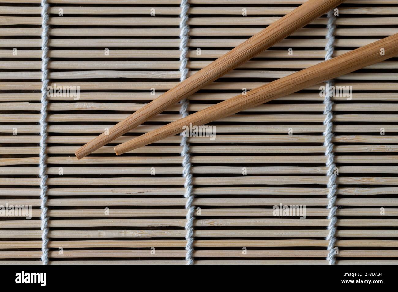 Top View of Chopsticks on a Bamboo Mat Stock Photo